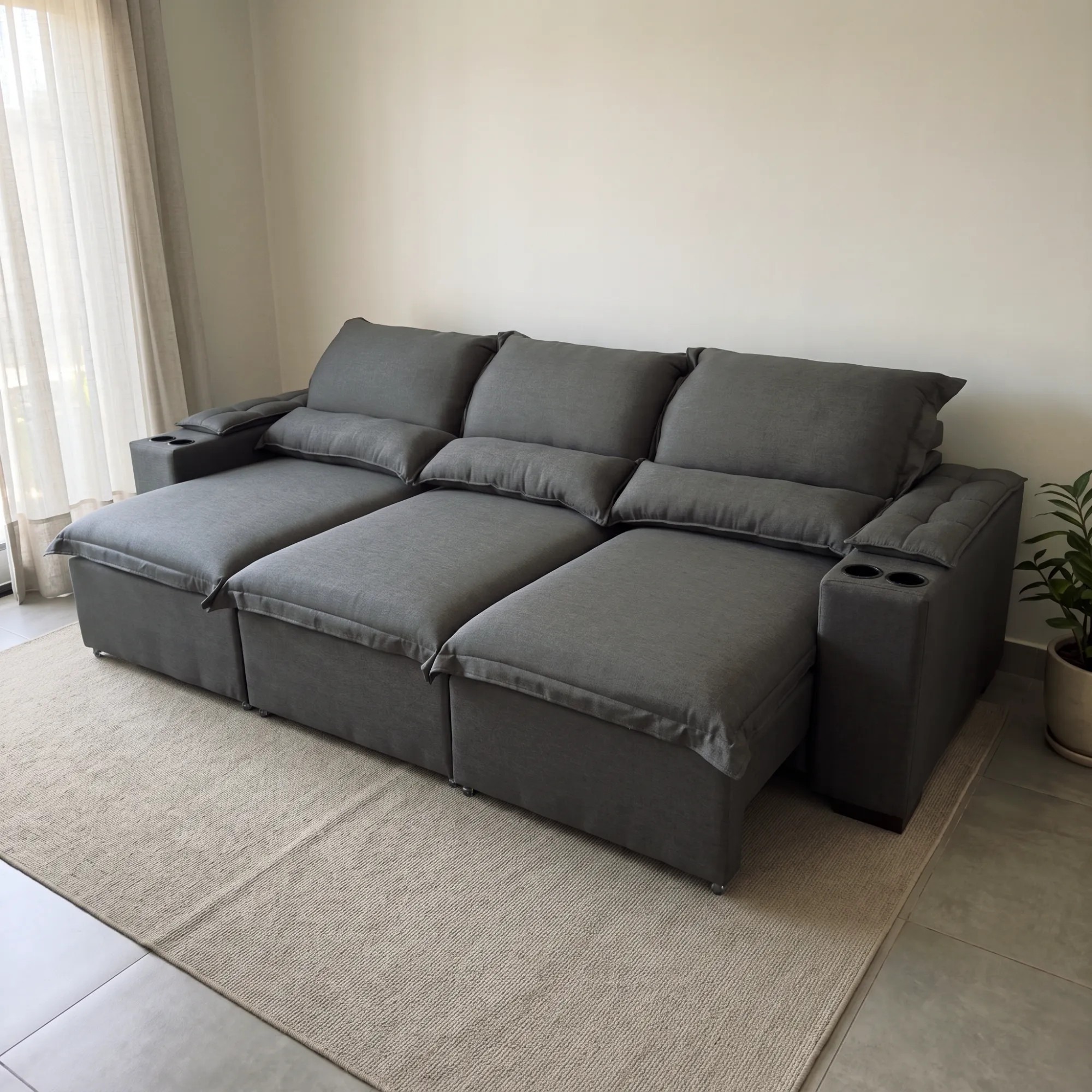 Sofá Florencia gris extendido y reclinado, con portavasos